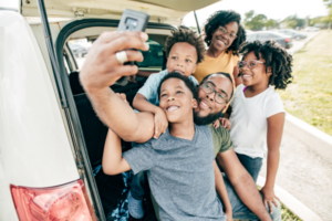 Family taking a selfie on a road trip