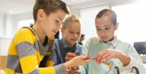 Kids using electronics in a science class