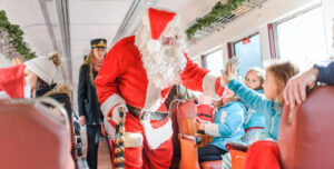 Santa greeting children on a train